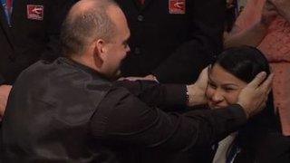 Stuart Bingham covers his wife Michelle's ears as the prize money amount is announced