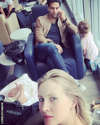 Radamel Falcao, his wife Lorelei Taron and their two children in an airport departure lounge