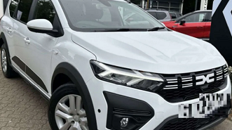 White Dacia Jogger Expression parked on pavement 