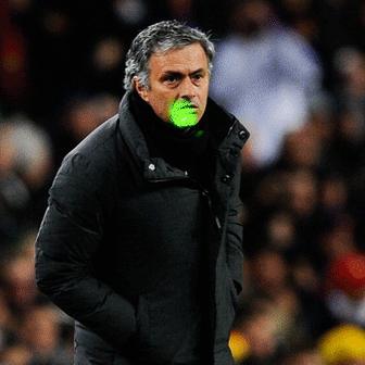 Football manager Jose Mourinho with a laser pen being shined at him