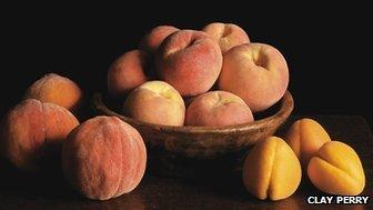 New large early apricot on ground with peregrine peach in bowl