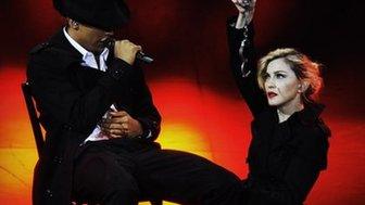 Madonna on stage in Paris with a dancer