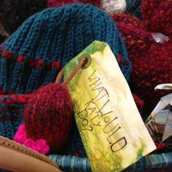 A wicker basket containing Kathryn's knitted hats