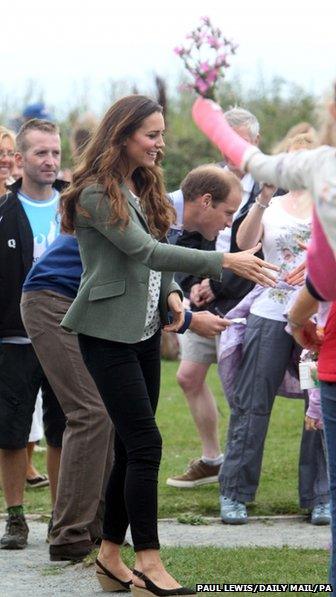 The duke and duchess greet well wishers