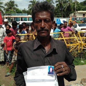 Babul Soiaal with a photo of his wife