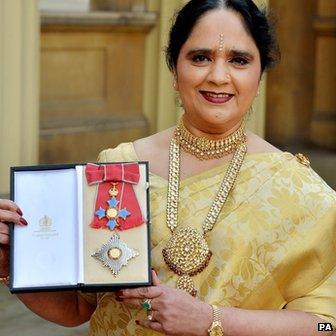 Dame Asha Khemka with her insignia of Dame Commander of the British Empire after