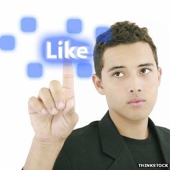 Man pressing "Like" button