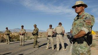 Federal law enforcement block a road in Nevada.