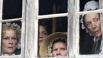 Cranford actresses peering out of window