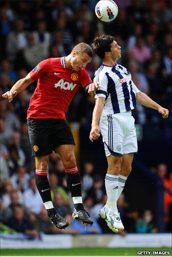 Nemanja Vidic (left) and Shane Long (right)