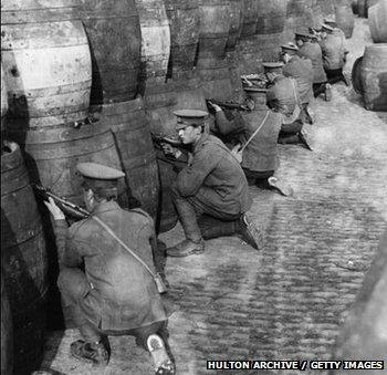 British troops behind a barricade of empty beer casks, near the quays in Dublin during the Easter Rising of 1916