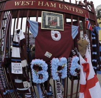 Fans laid scarves at the gates to West Ham's ground