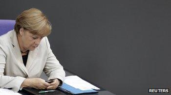 Angela Merkel using mobile