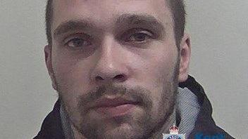 Close up police custody image of Adrian Badea 