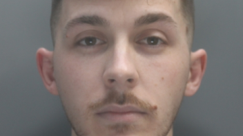 A police mugshot of Mehmet Tufan, then in his 20s, who has light brown hair and a moustache