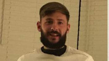 A photograph of Jamie Pearson shows him with dark brown hair and a dark brown beard