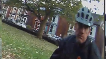 A photo of the man police want to trace in connection with the incident. He is wearing a bike helmet and a black jacket.