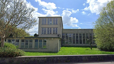 Entrance to school with grass in front