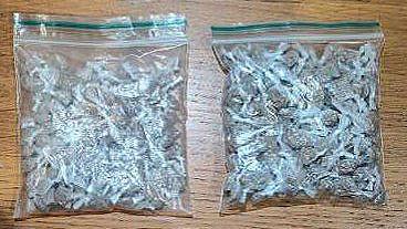 Two clear plastic bags containing heroin seized in police raids.