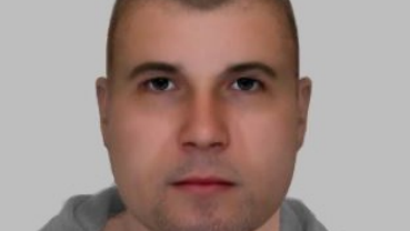 An e-fit image of a man with shaved stubble and dark eyes. He is aged between his late twenties and mid thirties.