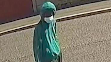 CCTV image of Axel Rudakubana wearing a green hoody with the hood up and a surgical face mask.