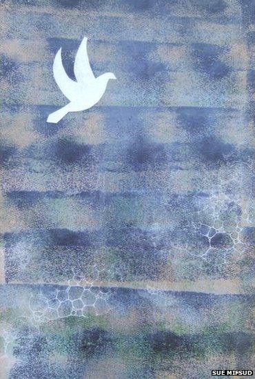 Ceramic image of dove against a blue background