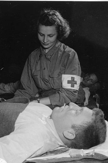 female nurse caring for a soldier