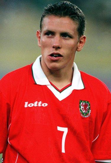 The young Norwich City striker is handed a start against Italy in Bologna in June 1999 but Wales lose 4-0 and Bobby Gould steps down as manager,