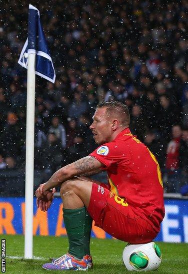 Bellamy takes a breather during Wales' 2-1 win over Scotland at Hampden Park in March 2013