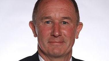 Councillor Tony Riordan. He is a middle-aged man with short brown hair and wearing a suit.