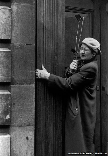 Woman using periscope device