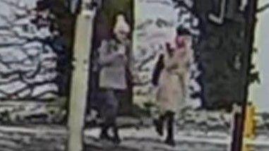 The sisters are caught in grainy CCTV in snow