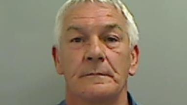 Mugshot of Jeffrey, He is clean shaven with short white hair