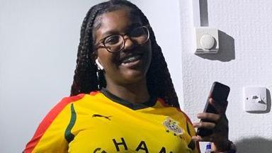 Elianne Andam wearing a yellow Ghana football shirt