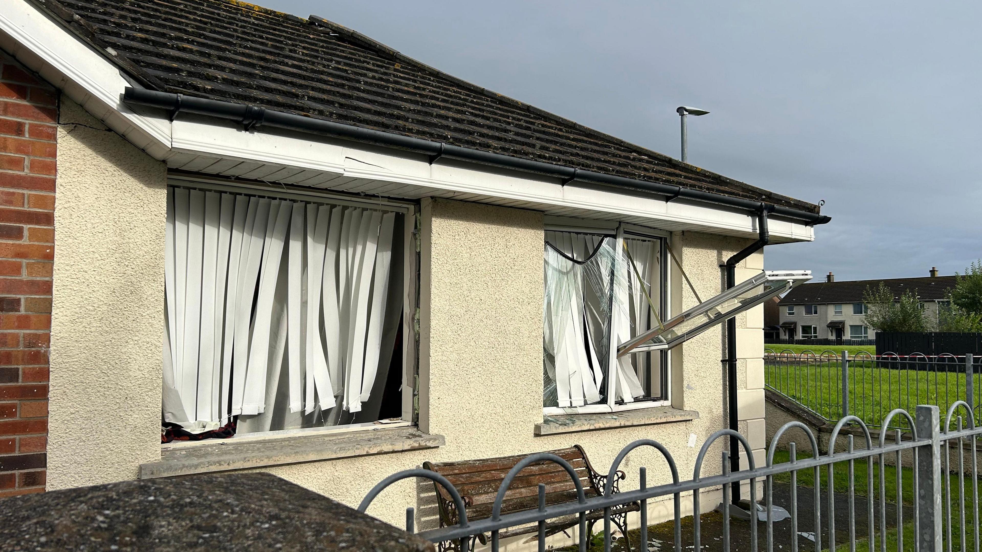 A bungalow in Dakota Avenue, Newtownards, with two front windows blown out 