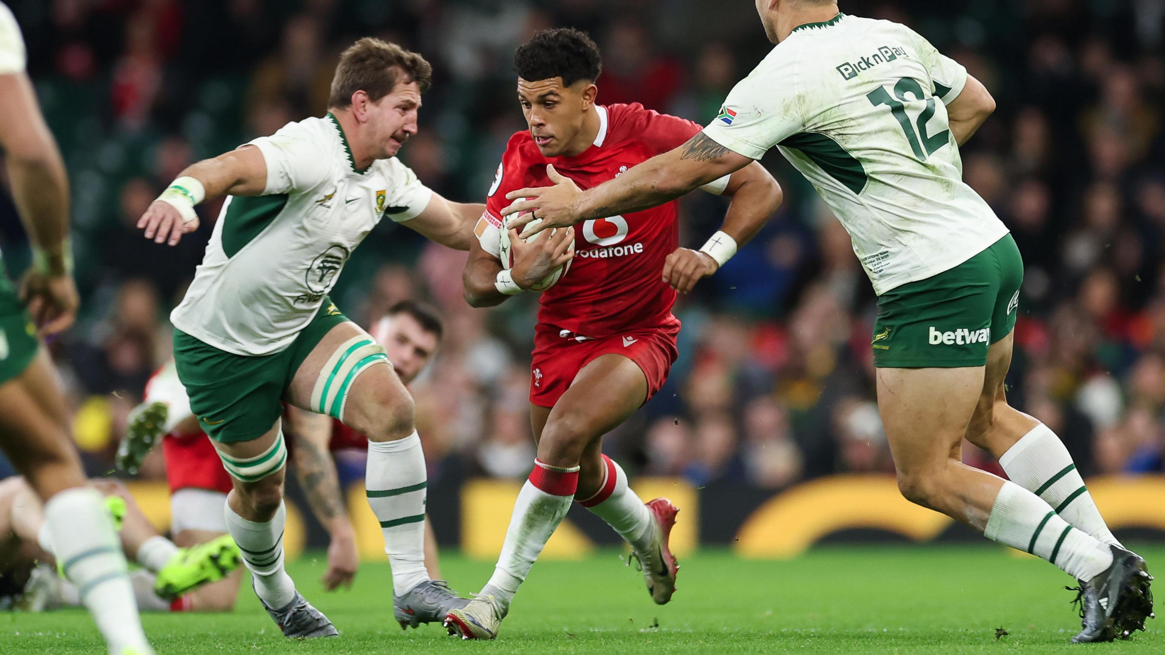 Dragons wing Rio Dyer runs with the ball for Wales against South Africa