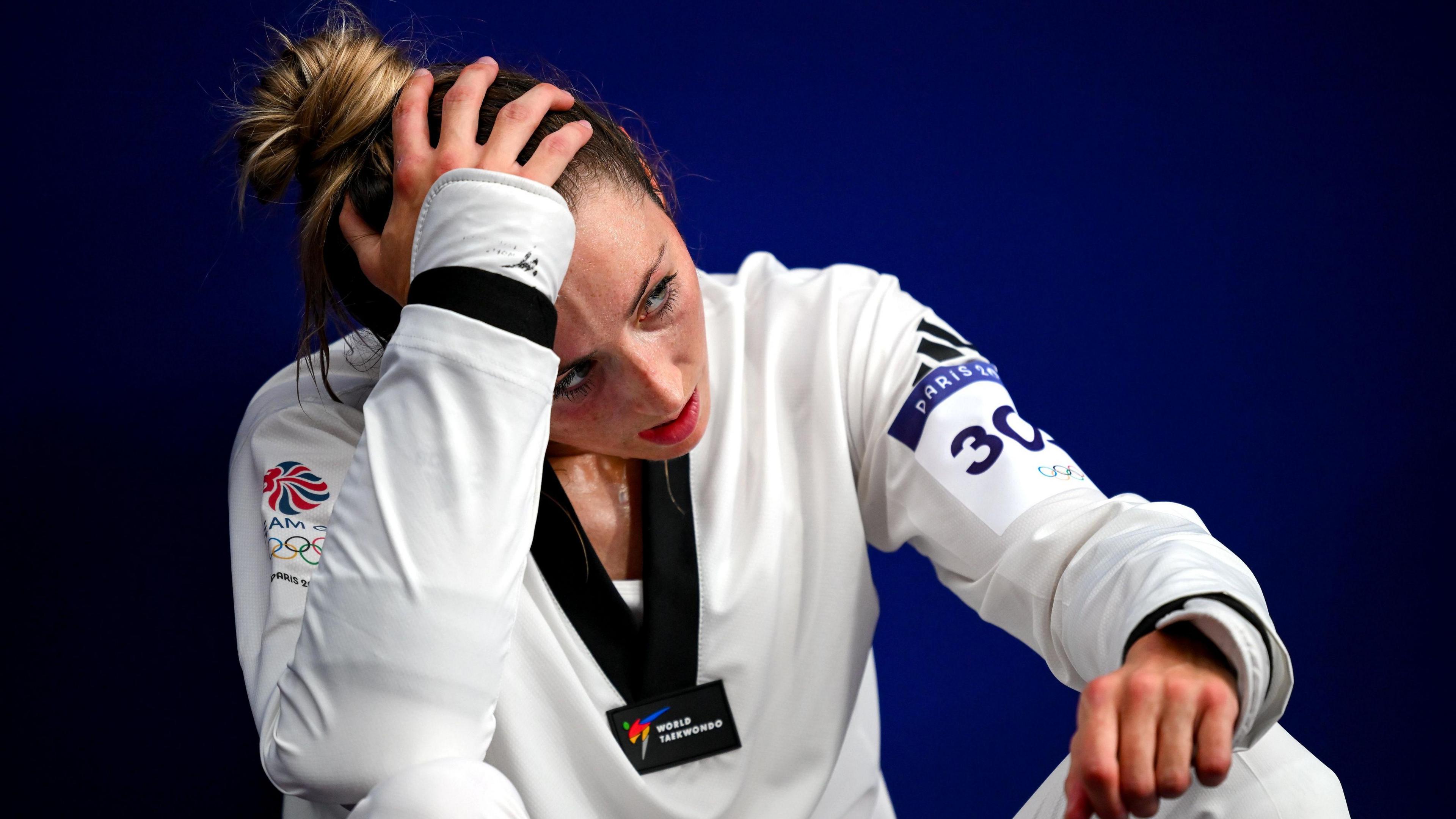 Jade Jones with head in her hands