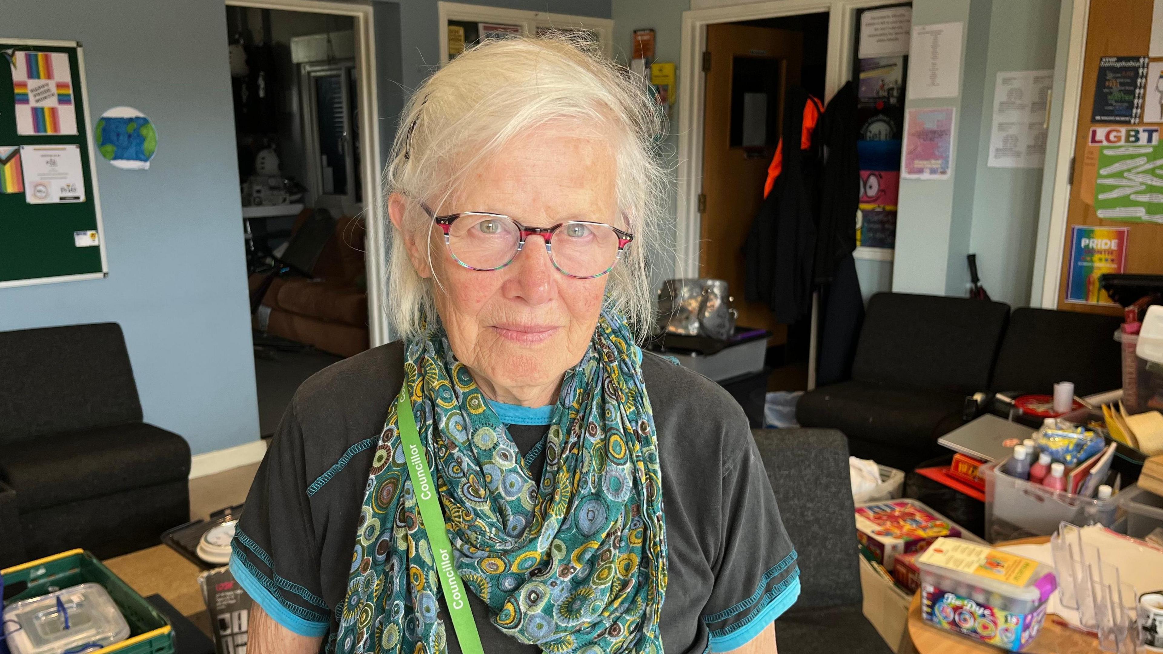 Councillor Liz Wright from Ashford Borough Council, Cabinet Member for Communities, Health and Wellbeing, stands inside Sk8side with board games and art materials packed into boxes ready to be removed