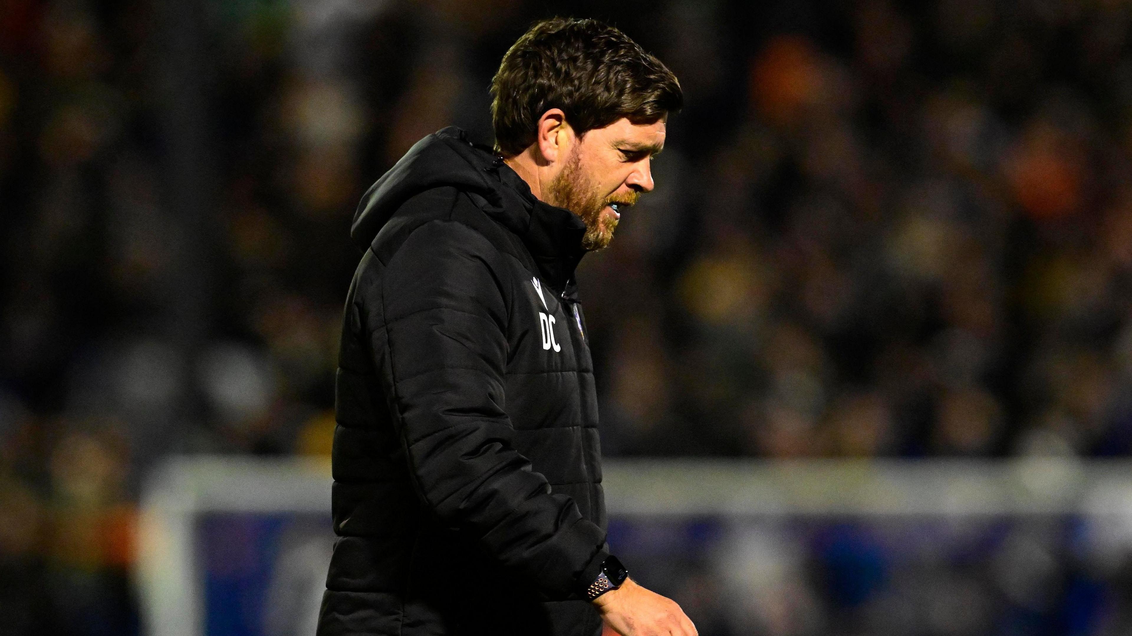 A photo of Bristol Rovers boss Darrell Clarke looking dejected