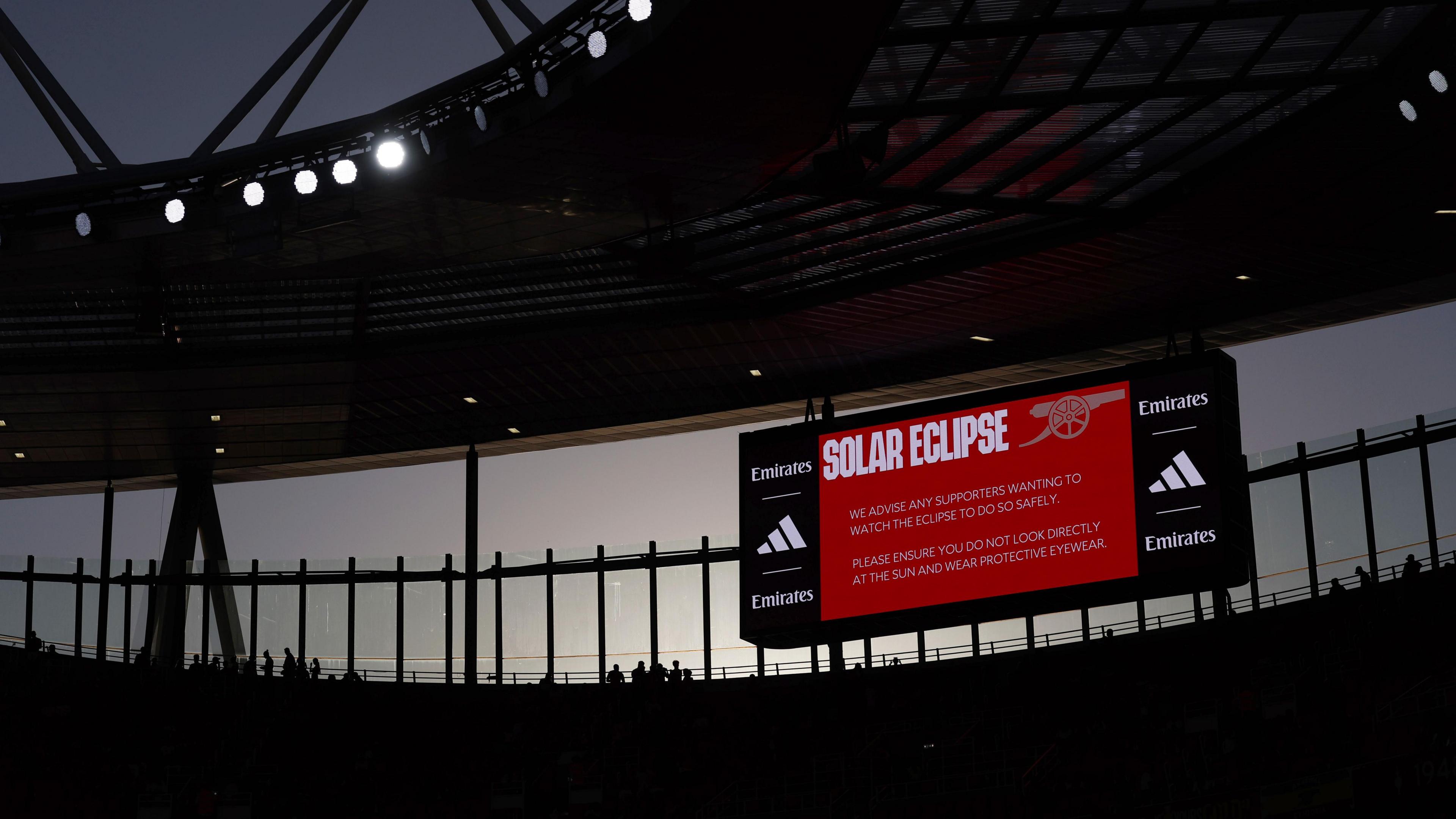 Arsenal show a message encouraging fans to wear protective glasses to watch the solar eclipse prior to their home pre-season friendly against Como
