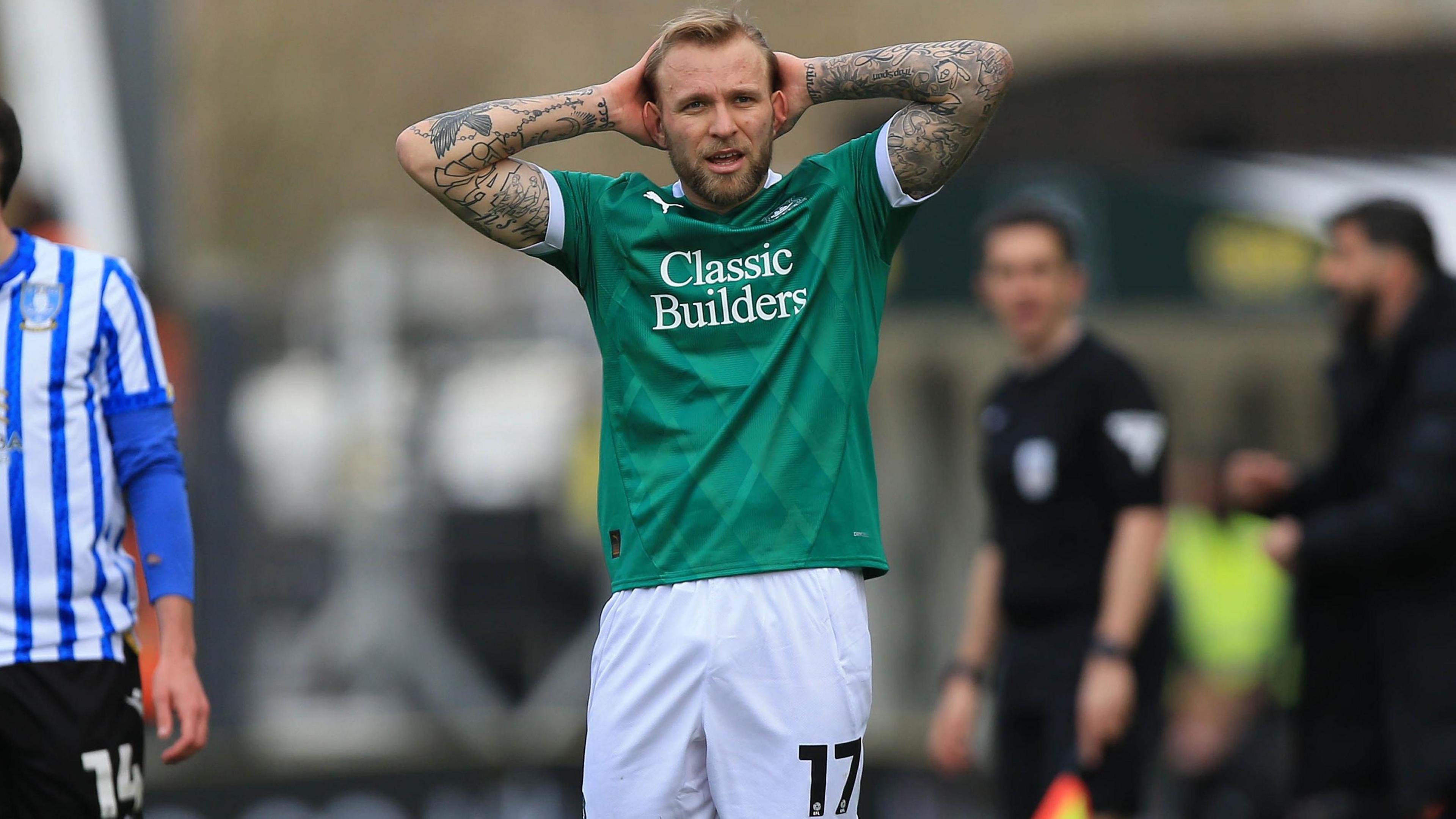 Plymouth's Tymoteusz Puchacz puts his hands on his head in frustration during the 3-0 defeat to Sheffield Wednesday