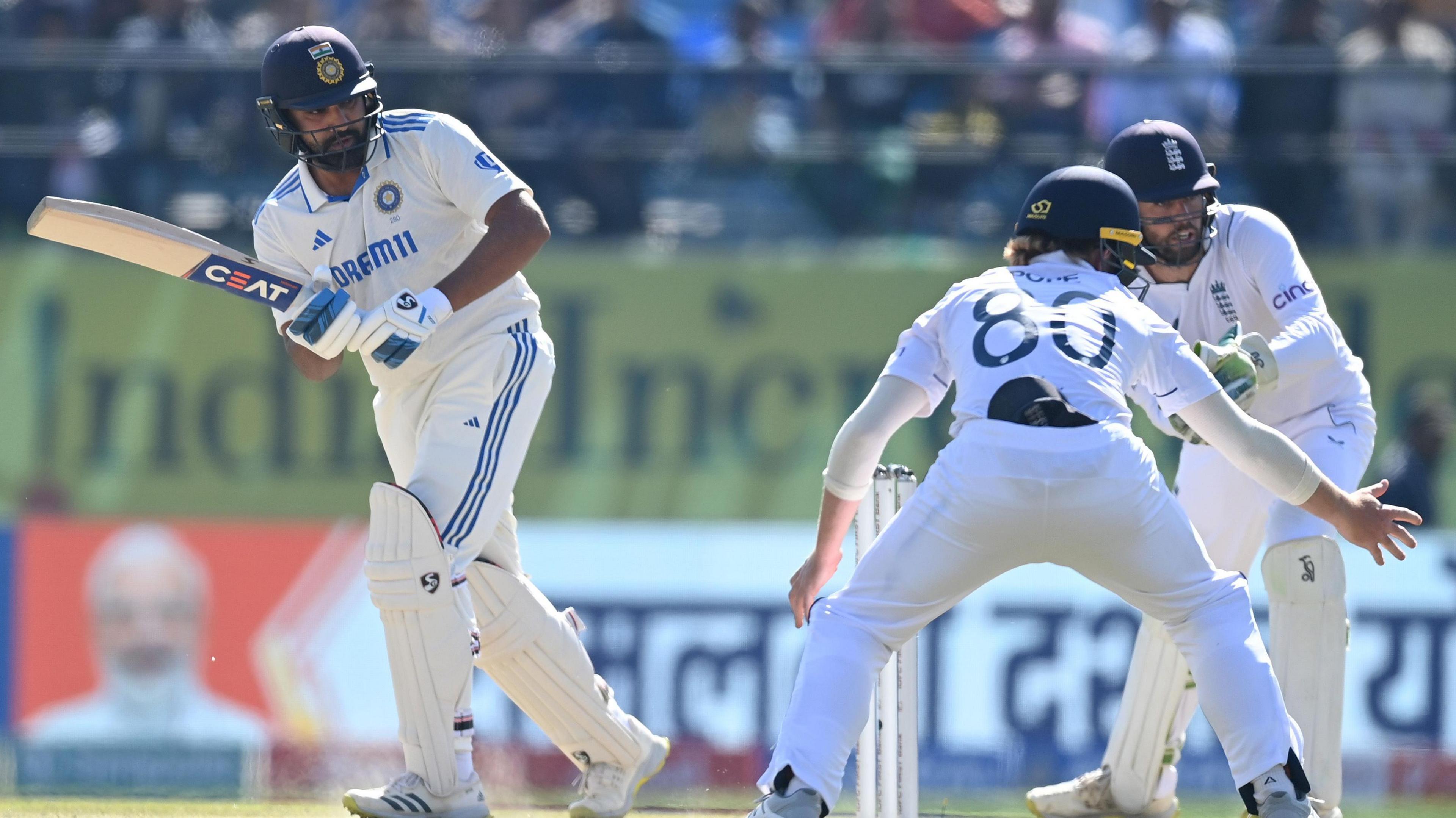 India captain Rohit Sharma hits the ball just wide of England fielder Ollie Pope