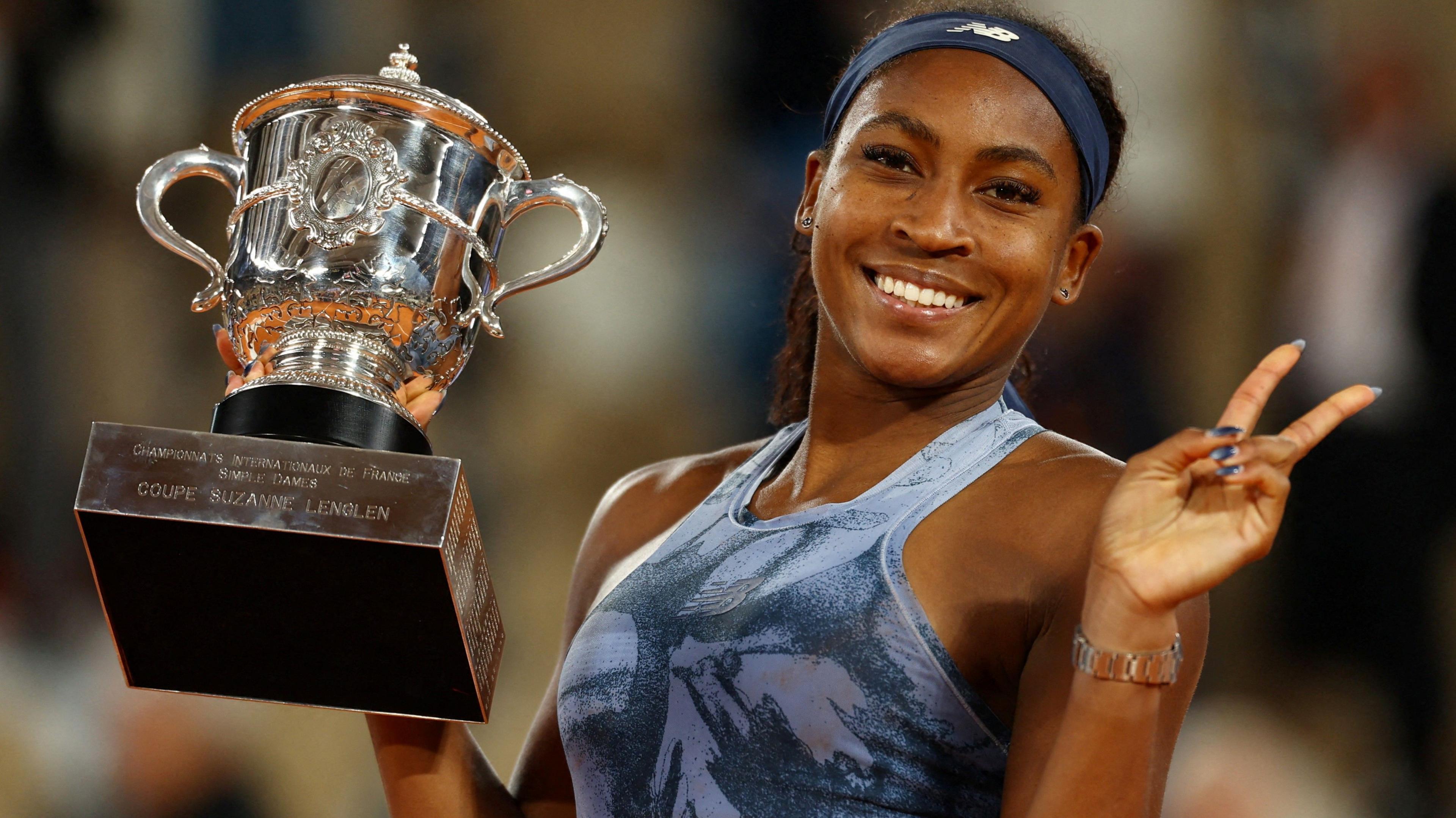 Coco Gauff celebrates with the French Open trophy in her hand
