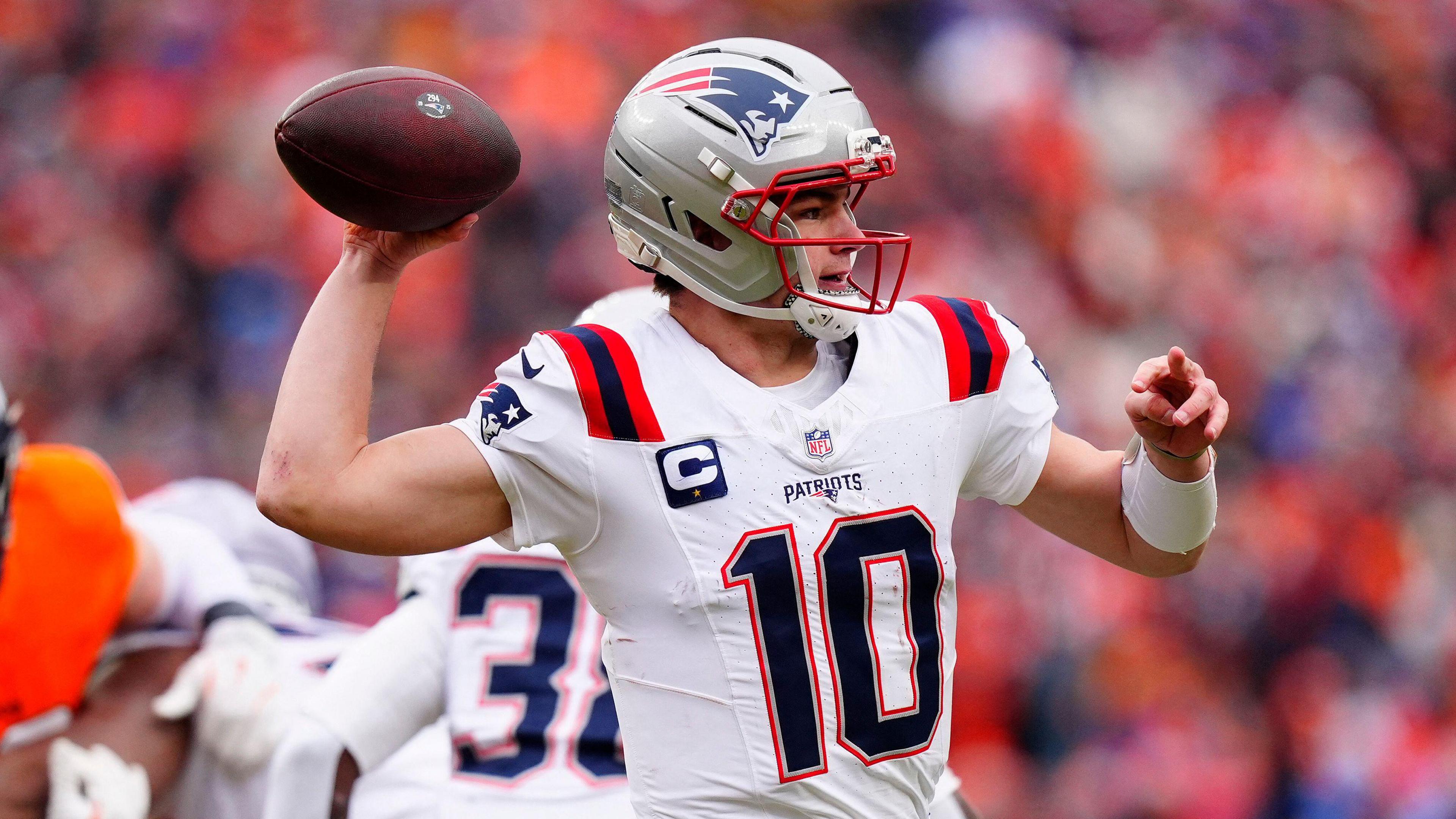 New England Patriots quarterback Drake Maye seen in his kit and holding the ball during a game 