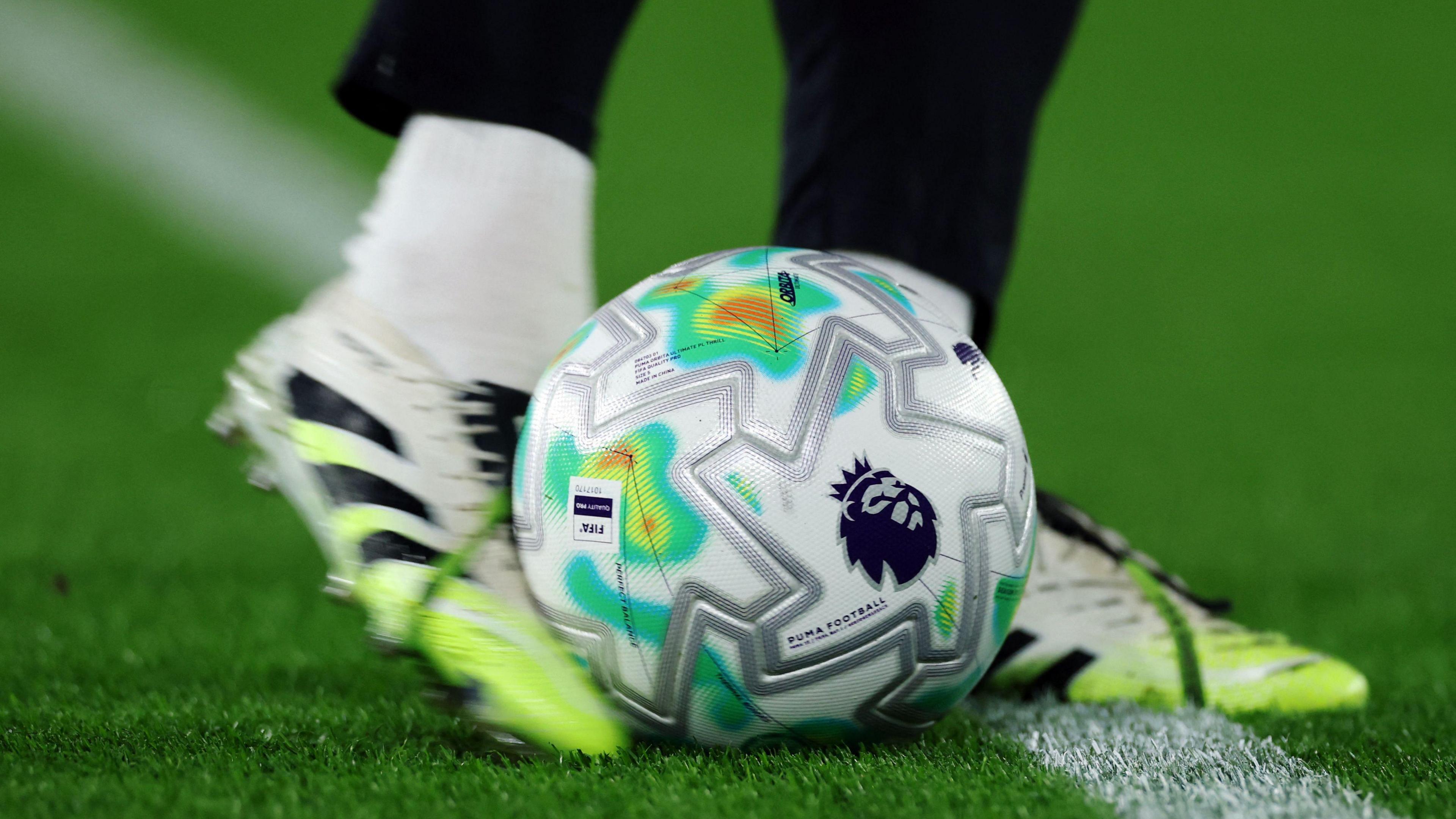 picture of a footballer kicking a ball