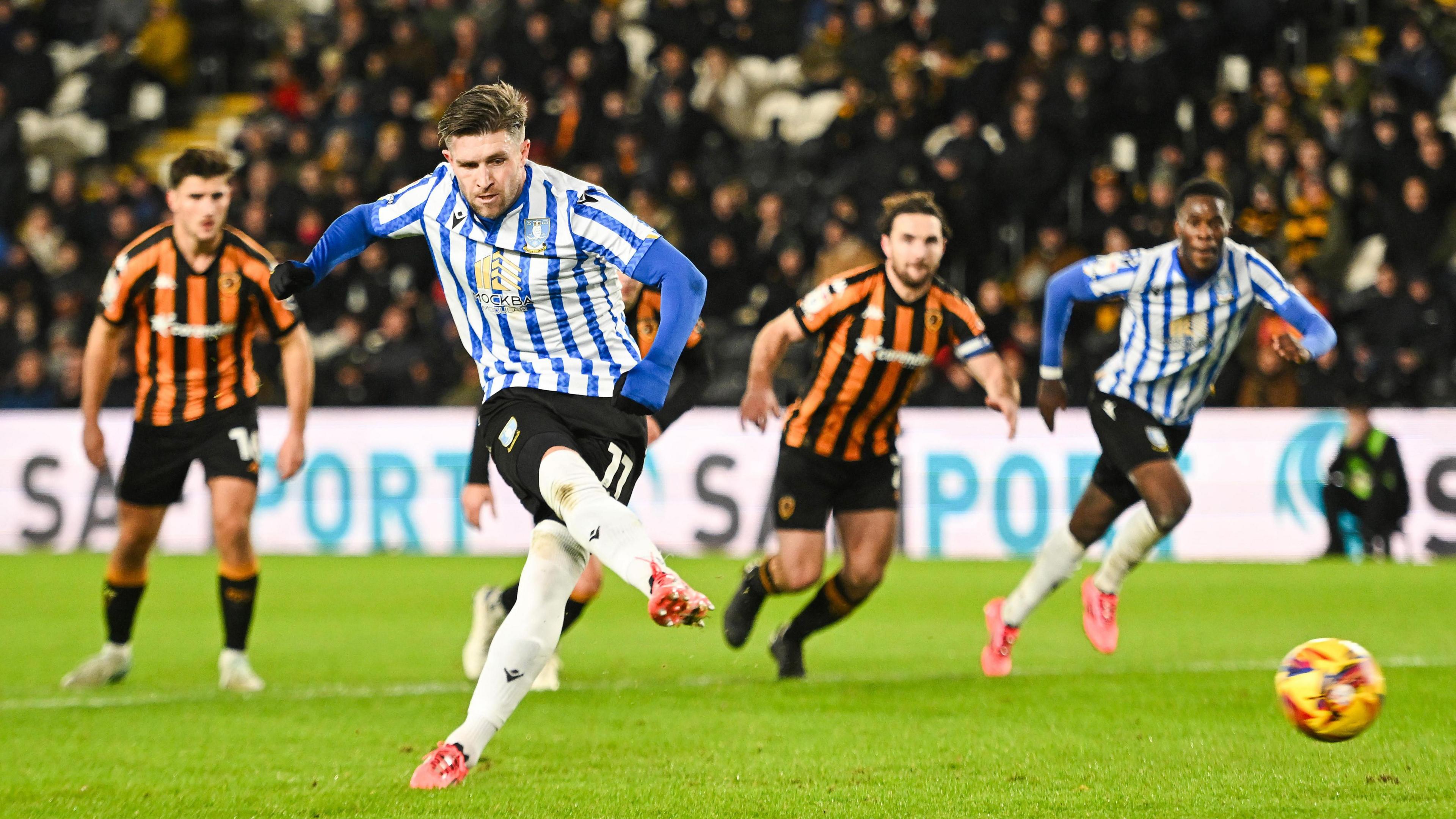 Josh Windass shoots the ball from the penalty spot