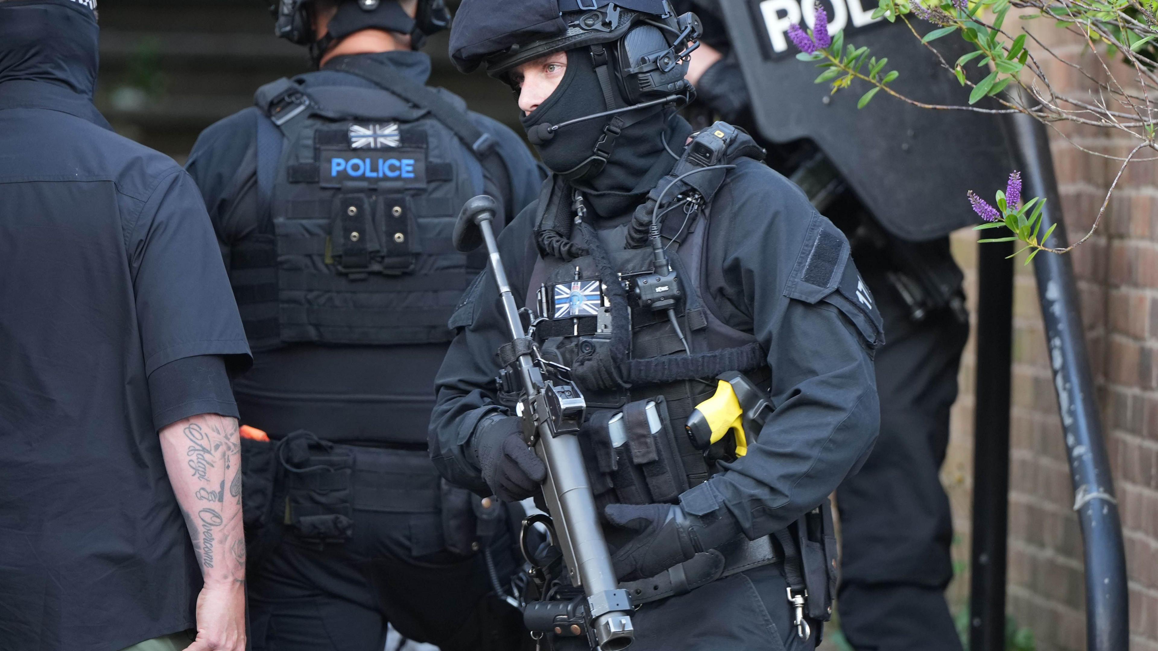 Several armed police officers in full kit at the Whitehawk Road incident.