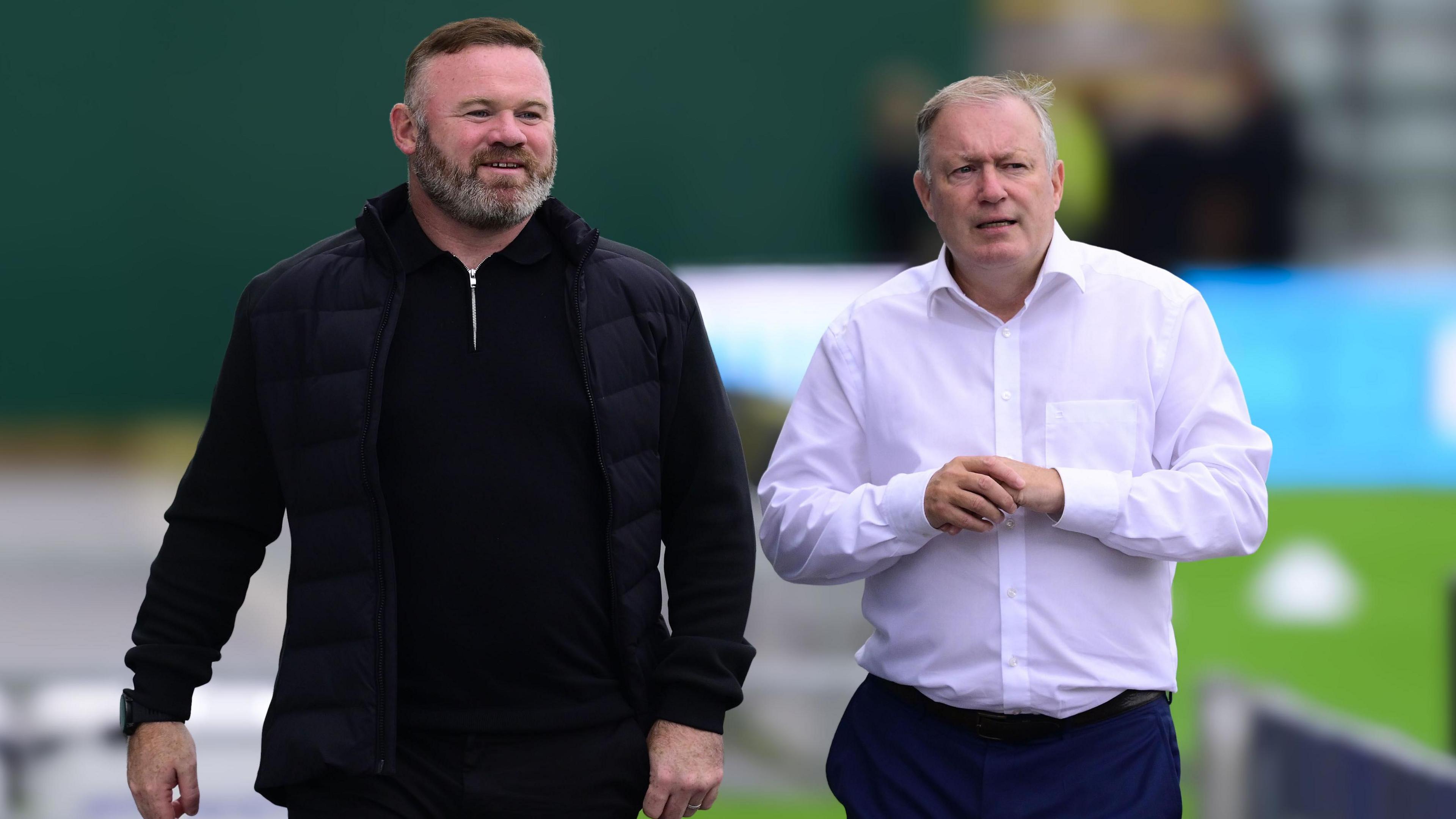 Wayne Rooney and Neil Dewsnip walk along