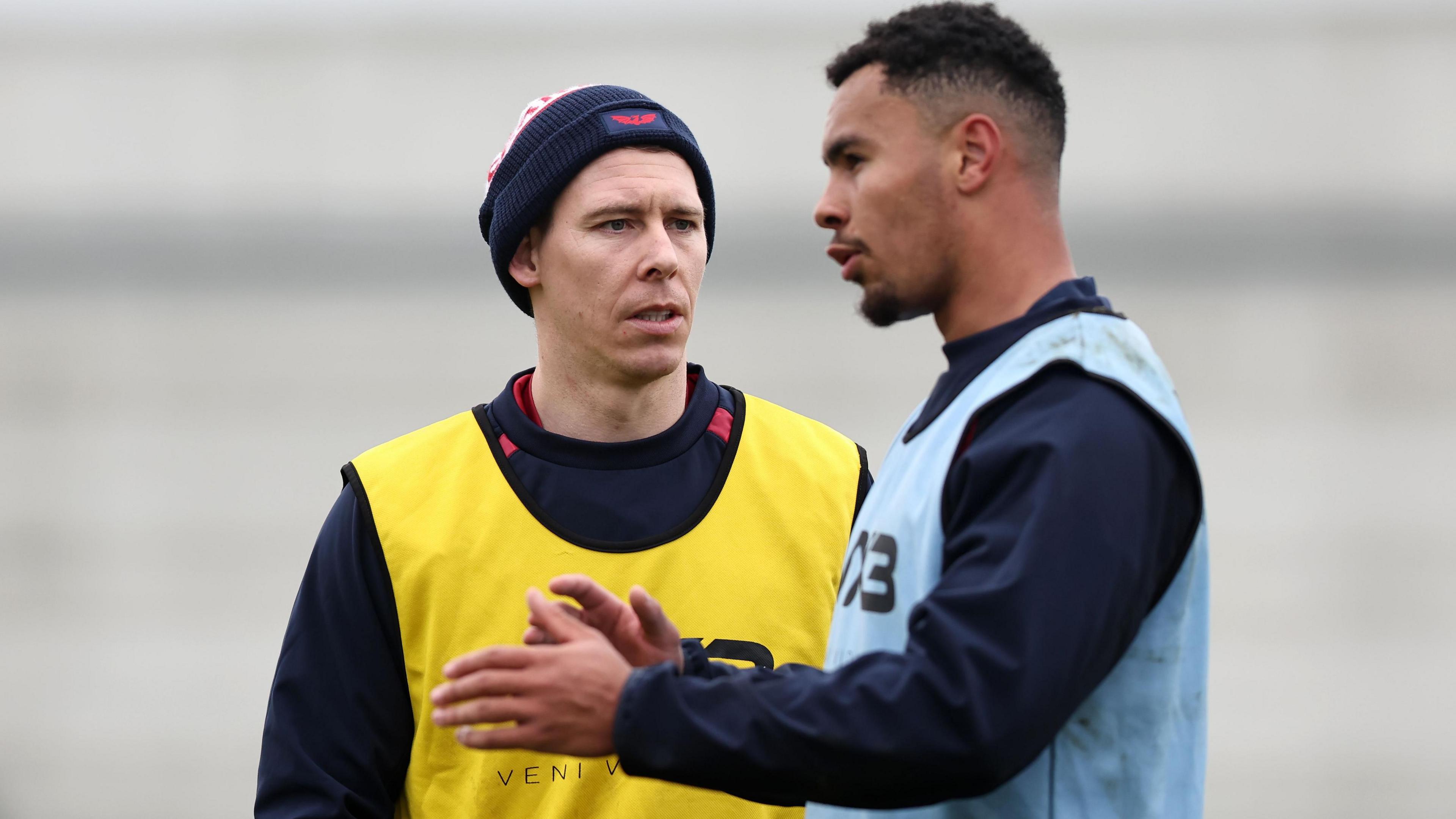Liam Williams (left) in conversation with Callum Woolley