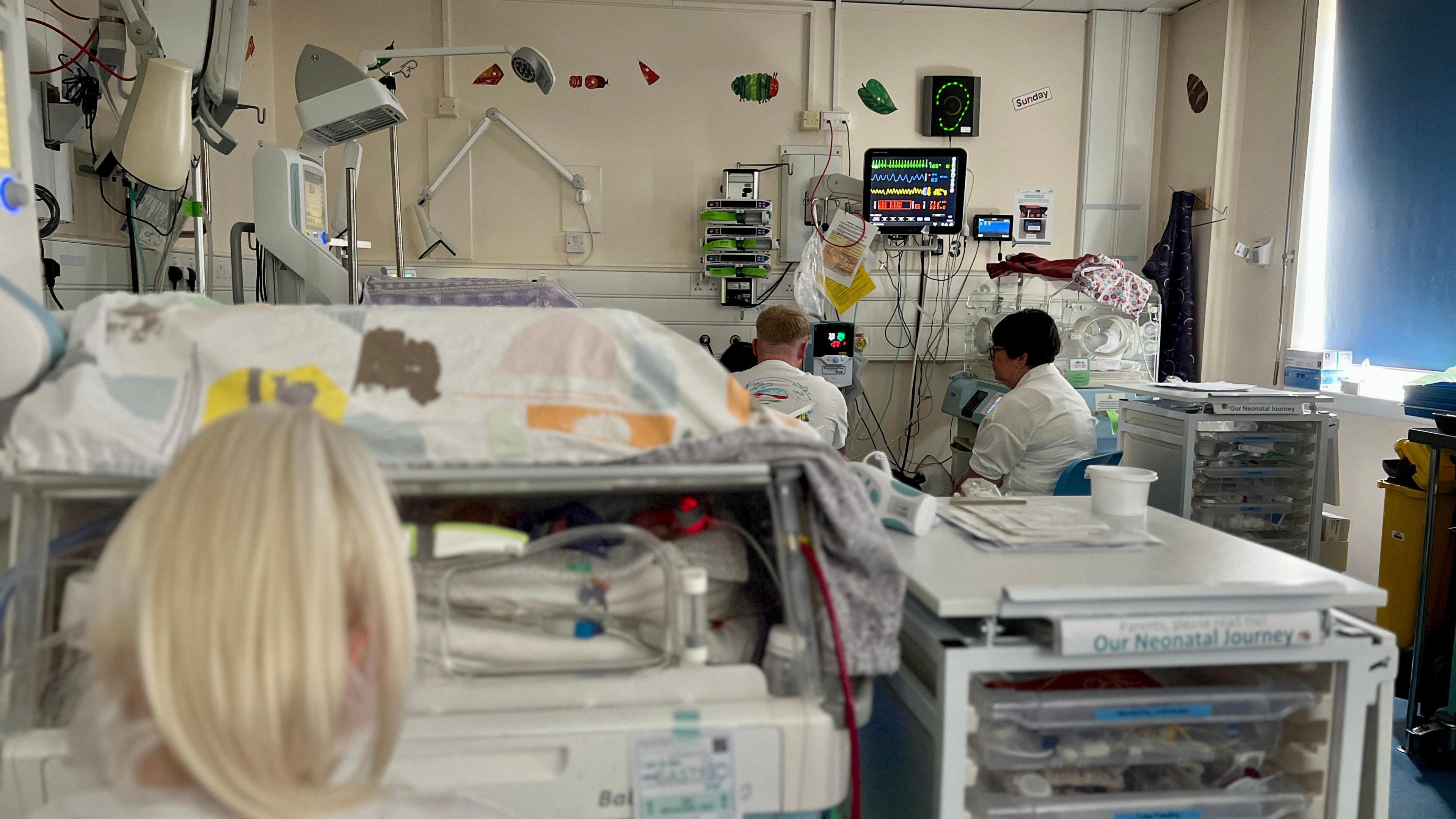 Milton Keynes Hospital neonatal unit shows families and beds and hospital equipment